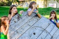 Four little girls blowing bubbles in the park Royalty Free Stock Photo