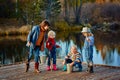 Four little girls catch fish on a wooden pontoon.Weekend at th Royalty Free Stock Photo