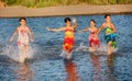 Four little girls having fun in the water on Ada bojana, Montene Royalty Free Stock Photo