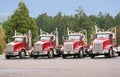 Four trucks in the maintenance yard. Royalty Free Stock Photo