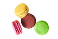 Four macaroons with different colors and varied taste, lemon, almond, chocolate, raspberry, strawberry and mint isolated
