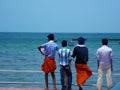 Four man looking at ocean outside Minakshi Temple Madurai