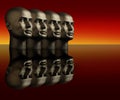 Four mannequin heads on a reflective surface
