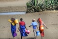 Four Massai women go to a water point