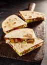 Four meat and veggie filled quesadillas