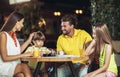 Four member family having great time in a restaurant