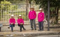 Four men dressed up for Chiang Mai Flower Festival