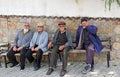 Four Men sitting on a bench in a old Turkish Village