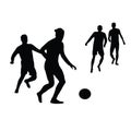 Four men playing fotball, body silhouette vector Royalty Free Stock Photo