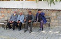Four Men sitting on a bench in a old Turkish Village