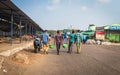 Four mens carrying fishes for sale at Visakhapatnam fishing harbour