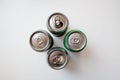 Four metal drink cans on white background from above