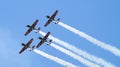 Four military propeller planes flying in the group Royalty Free Stock Photo