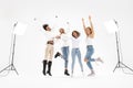 Four millennial multiethnic girlfriends jumping and laughing Royalty Free Stock Photo