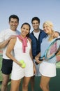 Four mixed doubles tennis players