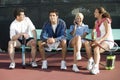 Four mixed doubles tennis players