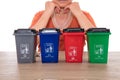 Four models of garbage sorting trash cans in front of Chinese women under careful observation Royalty Free Stock Photo