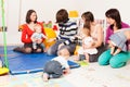 Group of mothers with their babies Royalty Free Stock Photo