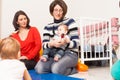 Group of mothers with their babies Royalty Free Stock Photo