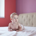 Four-month baby lying in bed
