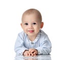 Four month Infant child baby boy in blue cloth lying happy looking at the camera isolated Royalty Free Stock Photo