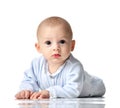 Four month Infant child baby boy in blue cloth lying happy looking at the camera isolated Royalty Free Stock Photo