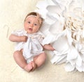 Four month Infant child baby girl in diaper lying happy smiling Royalty Free Stock Photo