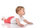 Four month Infant child baby girl lying in red pants on a floor Royalty Free Stock Photo