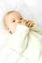 Four months old baby lies on the bed Royalty Free Stock Photo