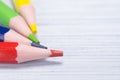 Four multicolored pencil lead, close-up, on a light background