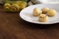 Four mushrooms exposed on white plate