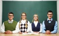 Four nerds in front of blackboard