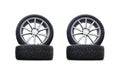 Four new good-looking snow tires isolated on the white background. A set of studded winter car tires. A set of wheels and tyre pac Royalty Free Stock Photo