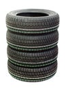 Four new tires stacked on white background Royalty Free Stock Photo