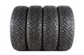 Four new winter car tires with spikes on a white background. Isolated Royalty Free Stock Photo