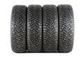 Four new winter car tires with spikes on a white background. Isolated Royalty Free Stock Photo