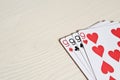 four nine poker hands playing cards on a light desk background. Royalty Free Stock Photo