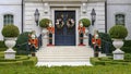 Four Nutcrackers guarding the door of a mansion in Highland Park at Christmas in Dallas County, Texas