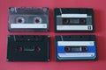 Four old cassettes on fusia background