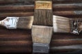 Four Old Dirty Crusty Household Paintbrushes on Rusted Corrugated Metal Background Royalty Free Stock Photo