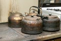 Old kettles standing on stove