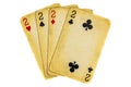 Four old dirty twos poker cards on a white background