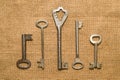 Four old keys to the safe on a very old cloth Royalty Free Stock Photo