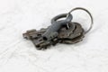 Four old padlock keys on a key ring Royalty Free Stock Photo