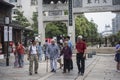 Four old people walked past the old gate of the East Gate. Royalty Free Stock Photo