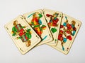 Four old under knave cards from deck of playing cards with german suits - acorn, leaf, heart and bell, isolated on white