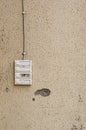 Four old and worn door bells on a beige wall Royalty Free Stock Photo