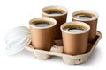 Four opened take-out coffee in holder