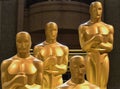 Four Oscar statues stand outside at the Academy Awards Royalty Free Stock Photo