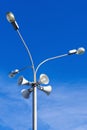 Four outdoor megaphones on street light